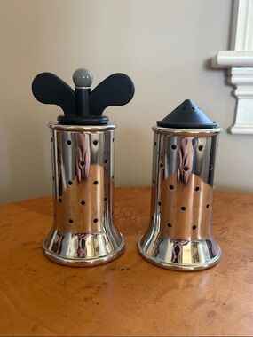 Alessi Stainless Steel Salt and Pepper Shakers with Black Tops.